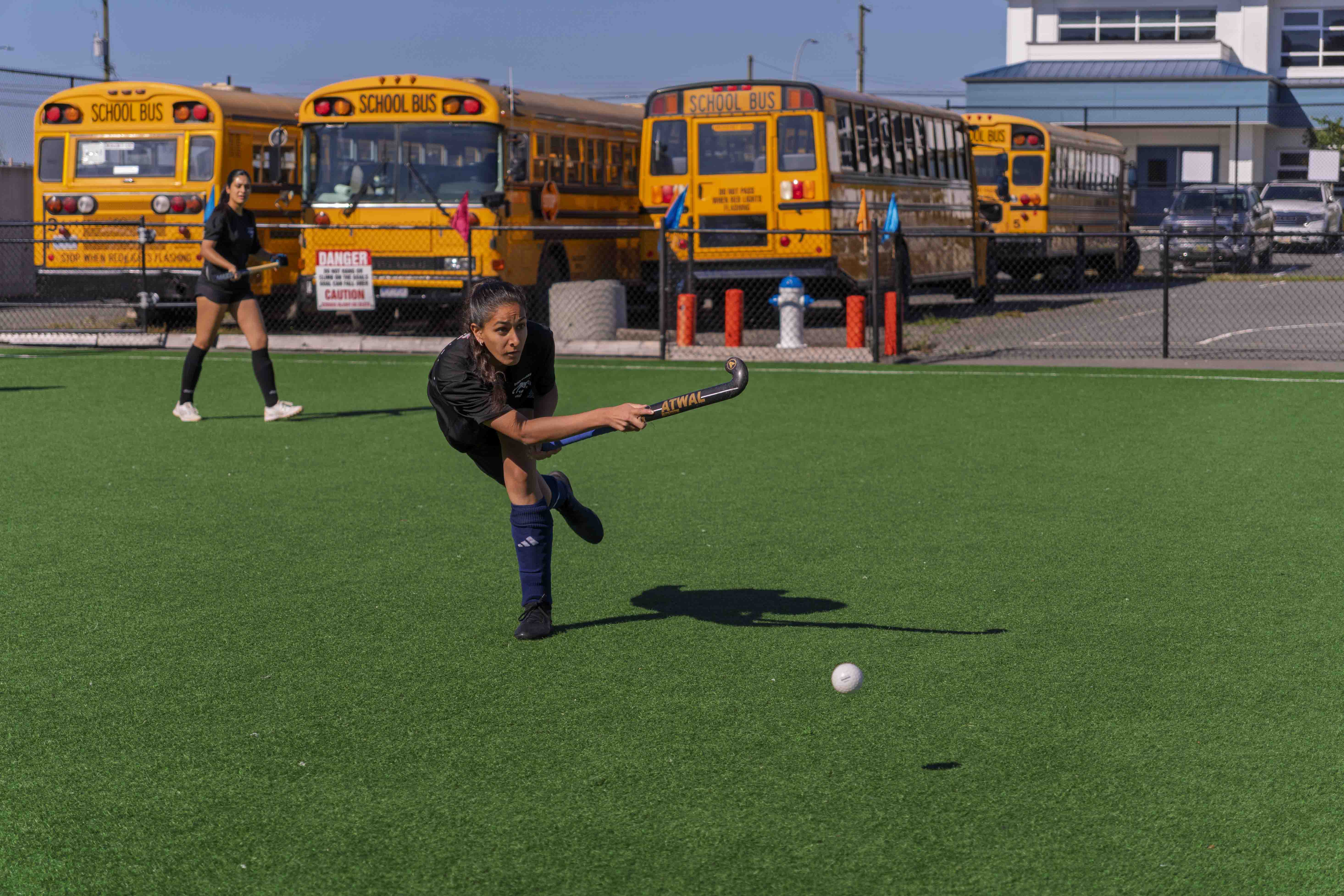 AFHC players competing in a field hockey match at Dasmesh Punjabi School field in Abbotsford, BC